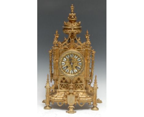 A 19th century French Gothic Revival ormolu mantel clock, 8.5cm circular dial inscribed upon enamel cartouches with Roman num