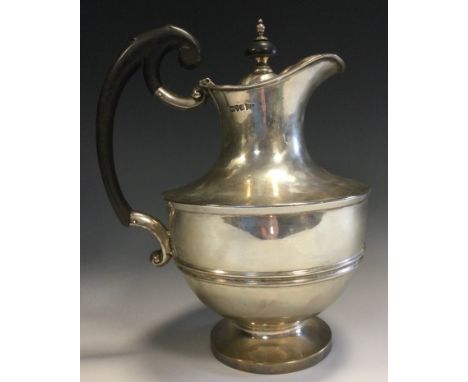 An Edwardian silver hot water jug, half girdle, ebonised scroll handle, button finial, 24cm high, Walker and Hall, Chester 19