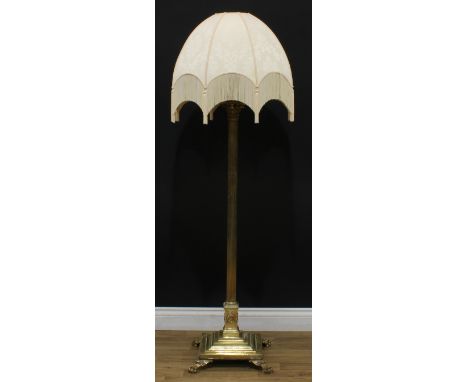 Interior Design - a brass telescopic standard lamp, as a Corinthian column, stepped square base, paw feet, 135.5cm extending 