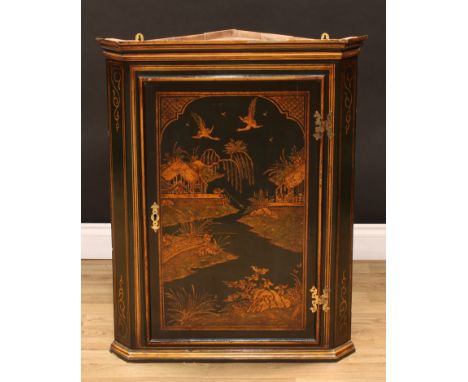 An 18th century style green japanned and chinoiserie decorated corner cabinet, moulded cornice above a rectangular panel door