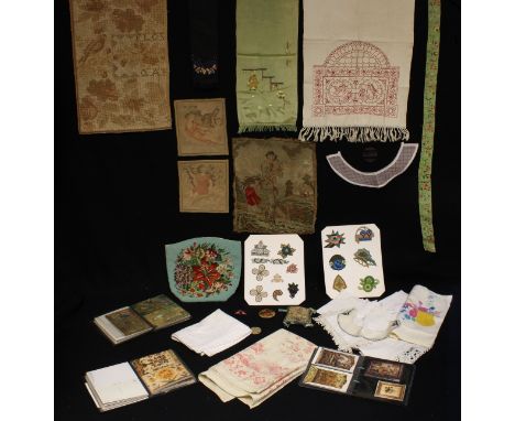 Textiles - an Arts and Crafts table cover, embroidered in red with a young boy and girl within an architectural niche decorat