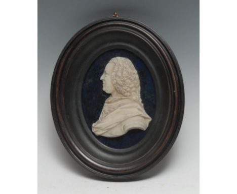 An 18th century wax portrait, King George II, bust length, facing to dexter, 9cm x 7cm, ebonised fruitwood frame, 17.5cm x 15