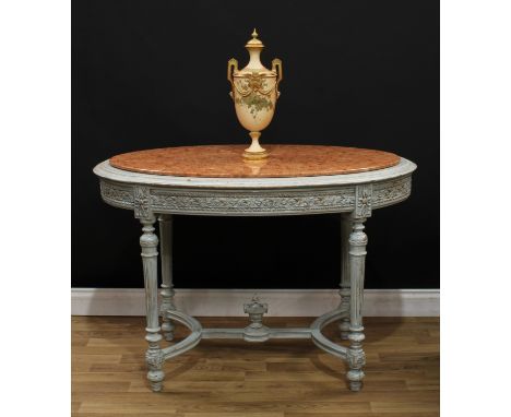 A Louis XVI Revival painted softwood oval centre table, marble top above a deep frieze carved with ribbons and leaves, turned