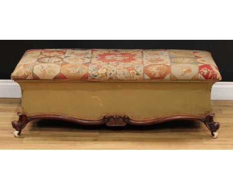 A Victorian mahogany ottoman box stool, stuffed-over woolwork upholstery, scroll legs, ceramic casters, 39cm high, 114cm wide