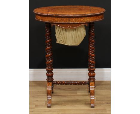 A Victorian walnut and marquetry work table, oval top with bead and reel border inlaid with fruiting vine enclosing a hinged 