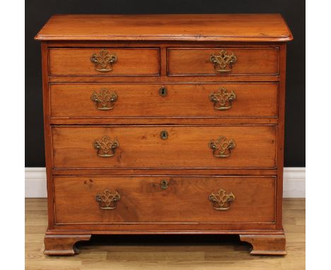 A George III mahogany chest, of small and neat proportions, rectangular top with moulded edge above two short and three long 