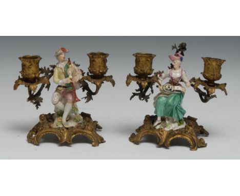 A Pair of 19th Century continental 'Meissen' porcelain and ormolu two light mantle candelabra, centered with seated figures a