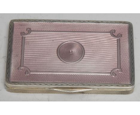 A George V silver and guilloche enamel rounded rectangular table snuff box, hinged cover decorated in tones of puce, engine t