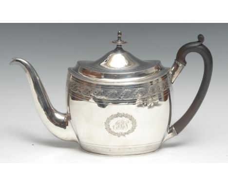 A George III silver oval teapot, bright-cut engraved with bands of stiff leaves and wrigglework, hinged domed cover with knop