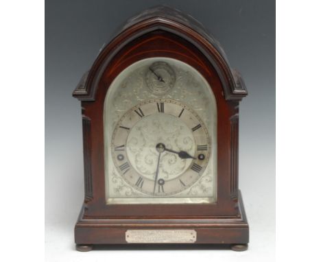 An early 20th century mahogany lancet musical bracket clock, 14cm arched silvered dial with Roman numerals, Slow/Fast to arch