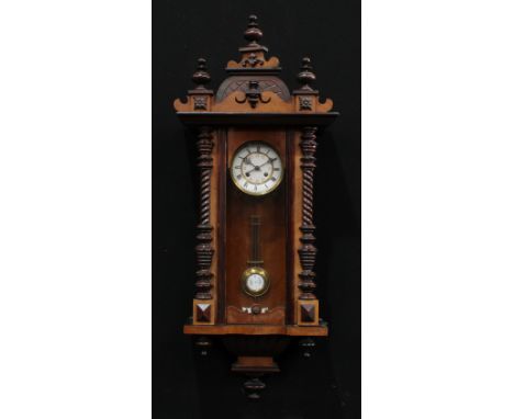 A 19th century walnut Vienna wall clock, 12.5cm enamel dial inscribed with Roman numerals, the centre with a further chapter 