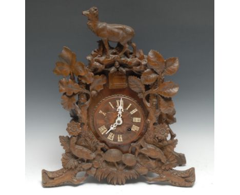 A Black Forest mantel cuckoo clock, 13.5cm dial applied with cut-card work Roman numerals, twin-winding holes, 8-day movement