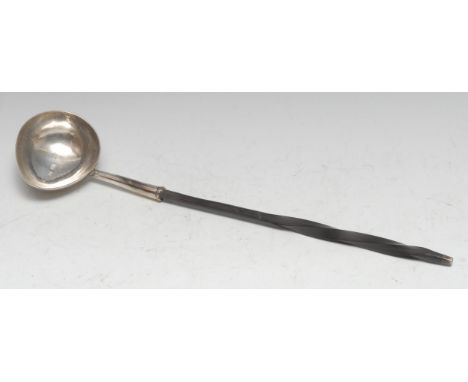 A George II silver punch ladle, boat shaped bowl, twisted whalebone handle, 34.5cm long, maker EA, London 1738 