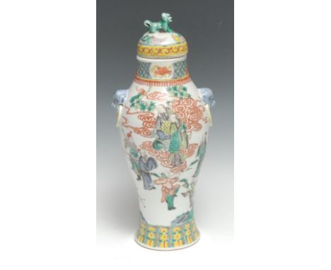 A Chinese famille verte porcelain inverted baluster vase, painted with courtly figures and sages in a landscape garden in pol