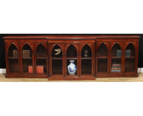 A substantial George/William IV mahogany break-centre low library bookcase, slightly oversailing top above a deep frieze and 