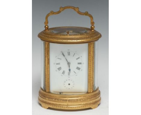 A good 19th century English repeater oval carriage clock, 7.5cm rectangular enamel dial with Roman and Arabic numerals, subsi