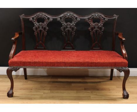 A Chippendale Revival triple chair back sofa, shaped cresting rail, shaped and pierced splats carved with C-scrolls and leave