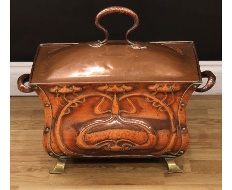 An Arts &amp; Crafts copper bombe-shaped fuel or coal bin and cover, the long sides pressed in the Art Nouveau taste with whi