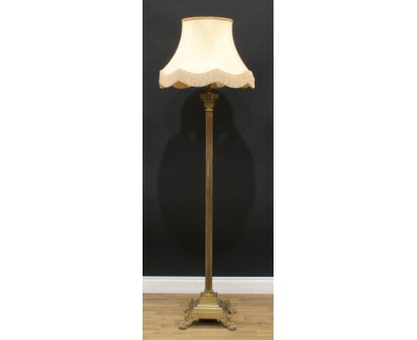 Interior Design - a brass standard lamp, as a Corinthian column, stepped square base, paw feet, 180cm high excluding shade 