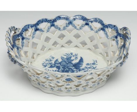 A Caughley Pine Cone oval basket,  in Worcester style, printed in underglaze blue with peony between two pine cones and a pom