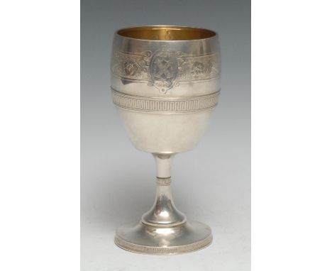 Tiffany &amp; Co - an American silver pedestal wine goblet, engraved with a band of scrolling foliage and strapwork above an 