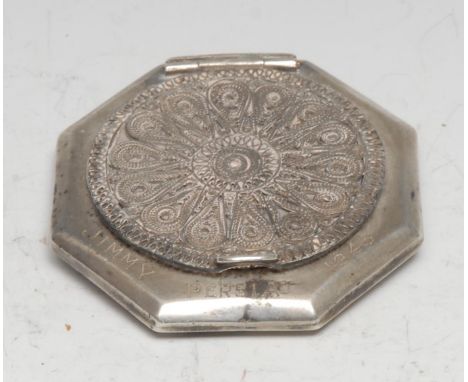 An Iraqi silver and niello octagonal compact, hinged filigree cover, decorated to verso with a Middle Eastern desert landscap