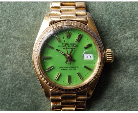 A boxed ladies 18ct gold Rolex Datejust wrist watch with green 'Stella' dial, gold baton markers, case diameter 25mm, on Pres