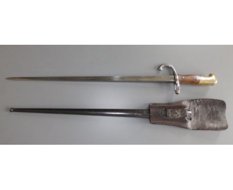 A French gras bayonet in scabbard - St. Etienne, February 1880, 23.5" overall,  with rare leather frog.