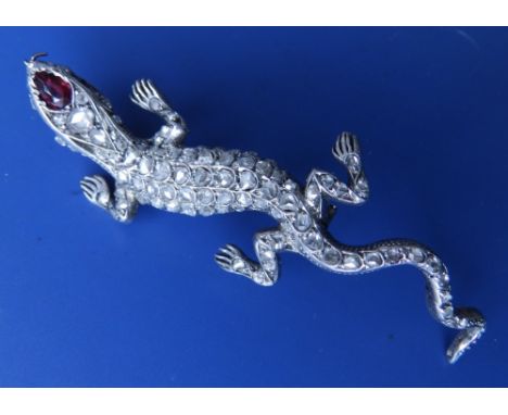 A rose cut diamond set lizard brooch with small ruby coloured cabochon eyes, French Control marks - circa 1900, 2.9".