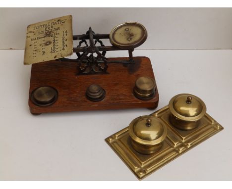 A set of oak-based postal scales, weights and a brass standish.