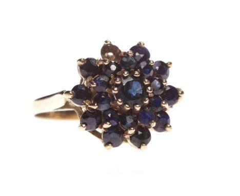 NINE CARAT GOLD GEM SET CLUSTER RING
the tiered bezel set with round blue gems, size L, 3g