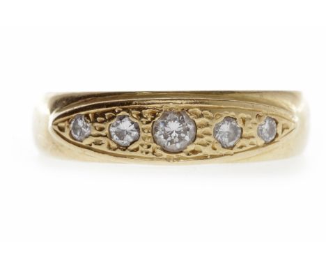 EIGHTEEN CARAT GOLD DIAMOND SET BAND
in the Victorian style, with an elliptical bezel set with five graduated round diamonds,