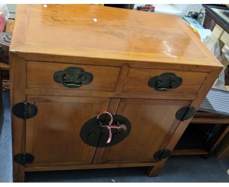 A Chinese light elm cabinet having two drawers above cupboard doors with brass fixings, 87cm h x 86.5cm wLocation:If there is