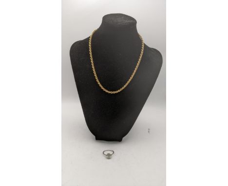 A 9ct gold rope twist style necklace 5.1g, along with a white metal and pace stone solitaire ring tested as platinum 4.3gLoca