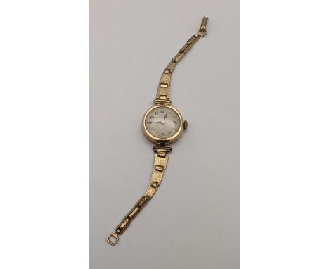 An early 20th century ladies 9ct gold manual wind wristwatch on a gold plated strapLocation: CAB 4If there is no condition re