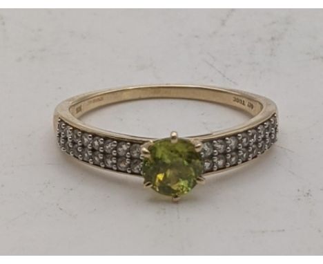 An Ambilobe sphene and white zircon 9ct gold ring, size Q, 2.2g, with certificate of authenticityLocation:If there is no cond