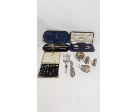 Silver to include silver cutlery and flatware to include a spoon and fork in a fitted case, four condiment pots to include a 