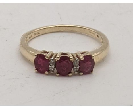 A Burmese ruby and Ratanakiri zircon 9ct gold ladies ring, size Q 2.4g with a certificate of authenticityLocation:If there is