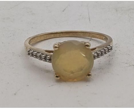 An Ethiopian opal and Ceylon white sapphire 9ct gold ring, size Q, 2.1g with a certificate of authenticityLocation:If there i