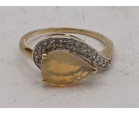 An Ethiopian opal and white zircon 9ct gold ring, size Q, 2.4g, with a certificate of authenticityLocation:If there is no con