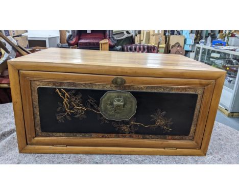 A set of three Chinese light elm and pine stacking cabinets, two having a fall flap panelled door and the other having two do