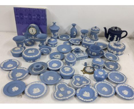 A collection of Wedgwood blue Jasperware to include a mantel clock, pill boxes, vases and others, together with a 19th centur