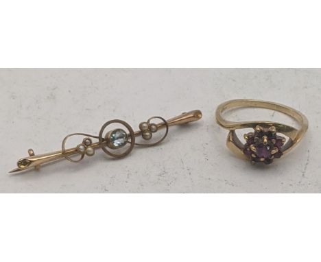 Gold to include a 9ct and ruby ring fashioned as the head of a flower, 3.5g together with a 15ct gold brooch set with a centr