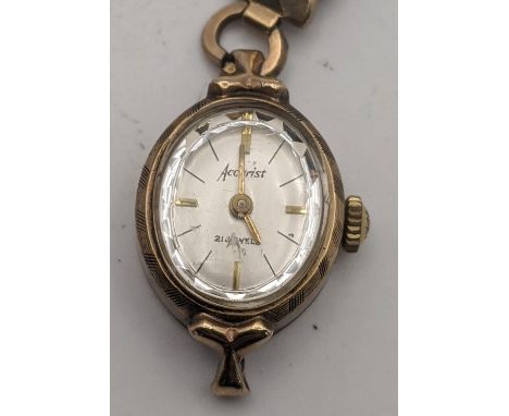 A 9ct gold Accurist manual wind wrist on a later expanding strap total weight 13.7gLocation:If there is no condition report s