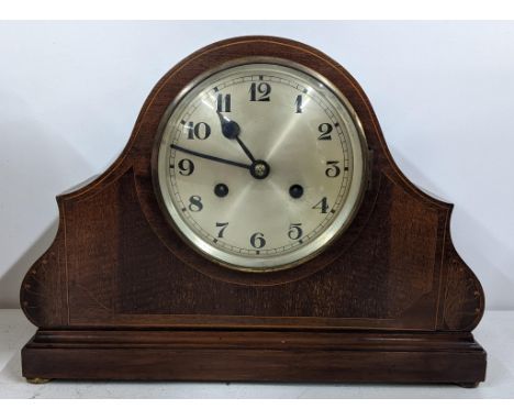 An Edwardian mahogany arched top 8-day mantel clock, striking on a single gong, 26.5cm h x 35.5cm wLocation:If there is no co