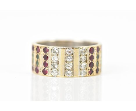 A 9ct yellow and white gold ring, inset with rows of eight emeralds, sixteen rubies and twelve diamonds, white gold interior 