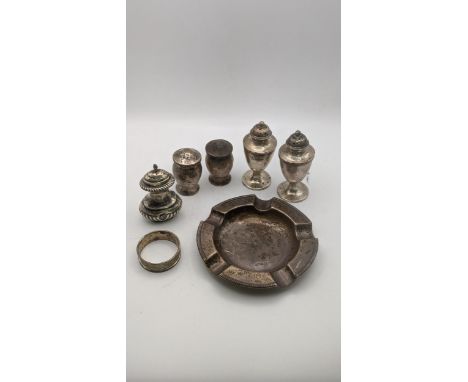Silver to include a pair of pepper pots and similar examples, an ashtray and napkin ring, total weight 329.6gLocation:If ther