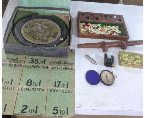 A mixed lot to include a WWI British Army 1915 trench whistle, a WWI Princess Mary Christmas tin, a Sandown Races roulette ga