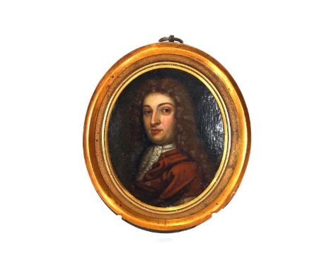 An 18th Century oval portrait miniature of a Georgian gentleman in gilt frame, old label to the reverse, painting size 8cm x 