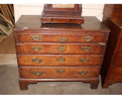 A Georgian oak chest of four long graduated drawers raised on bracket feet, 93cm wide&nbsp;